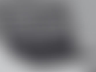 Image of a laptop screen with an online meeting with multiple participants in progress