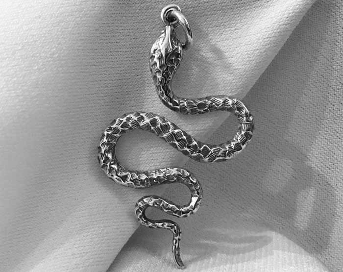 ornate snake pendant