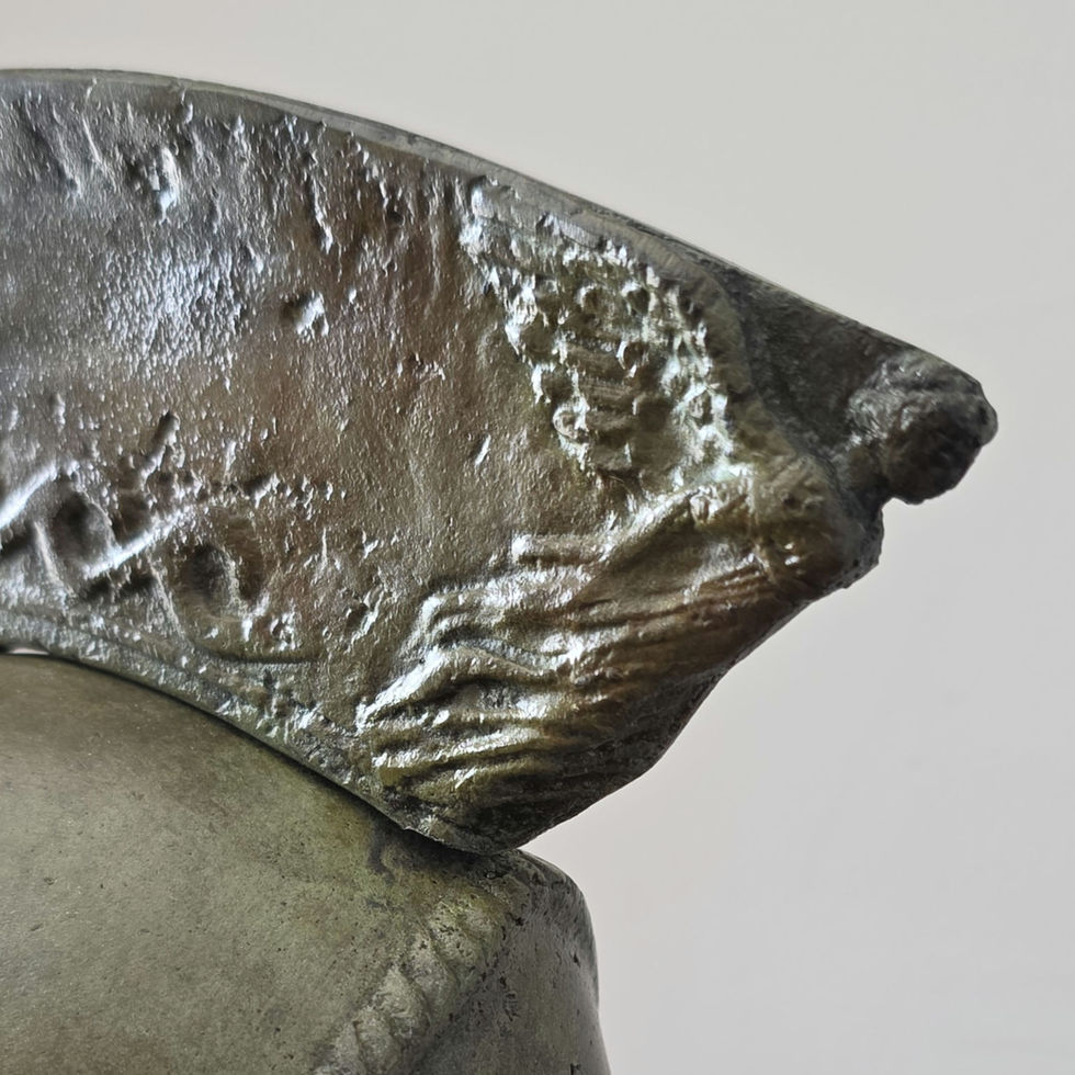 large bronze helmet with Nike goddess of victory