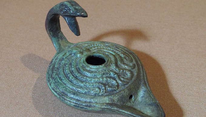 bronze oil lamp with octopus and serpent