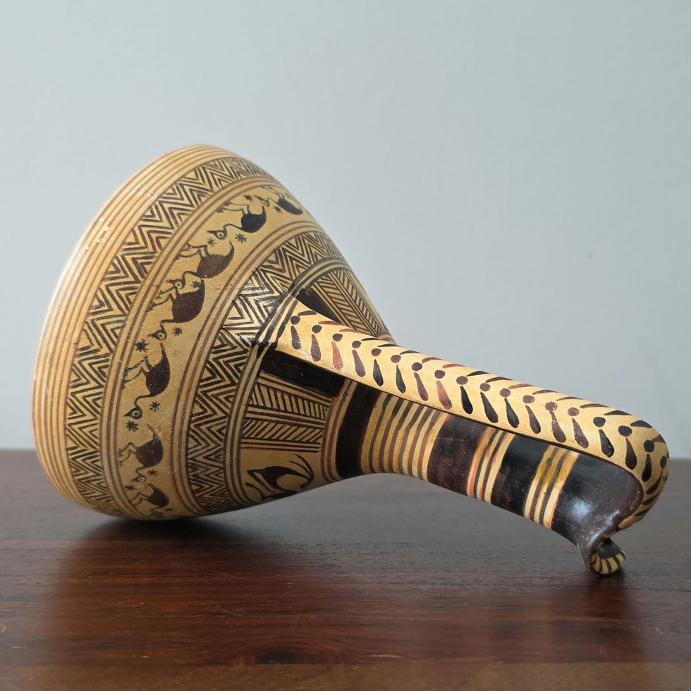 Geometric oinochoe with ibex and birds decoration