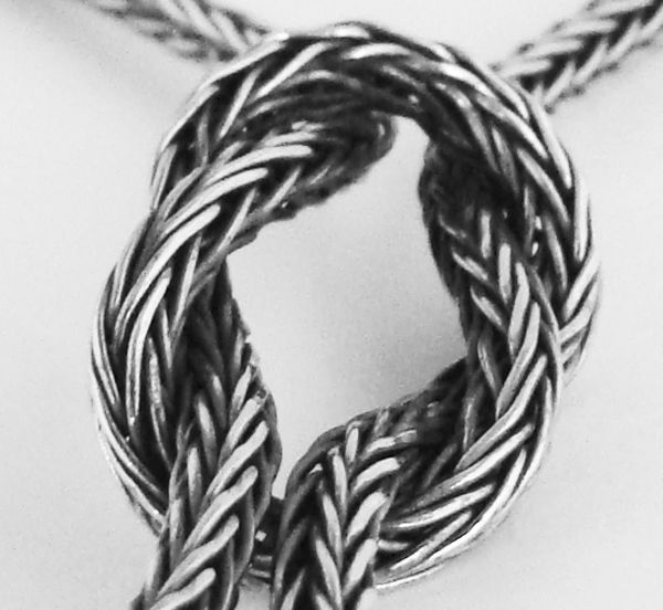 woven necklace with loveknot and rams