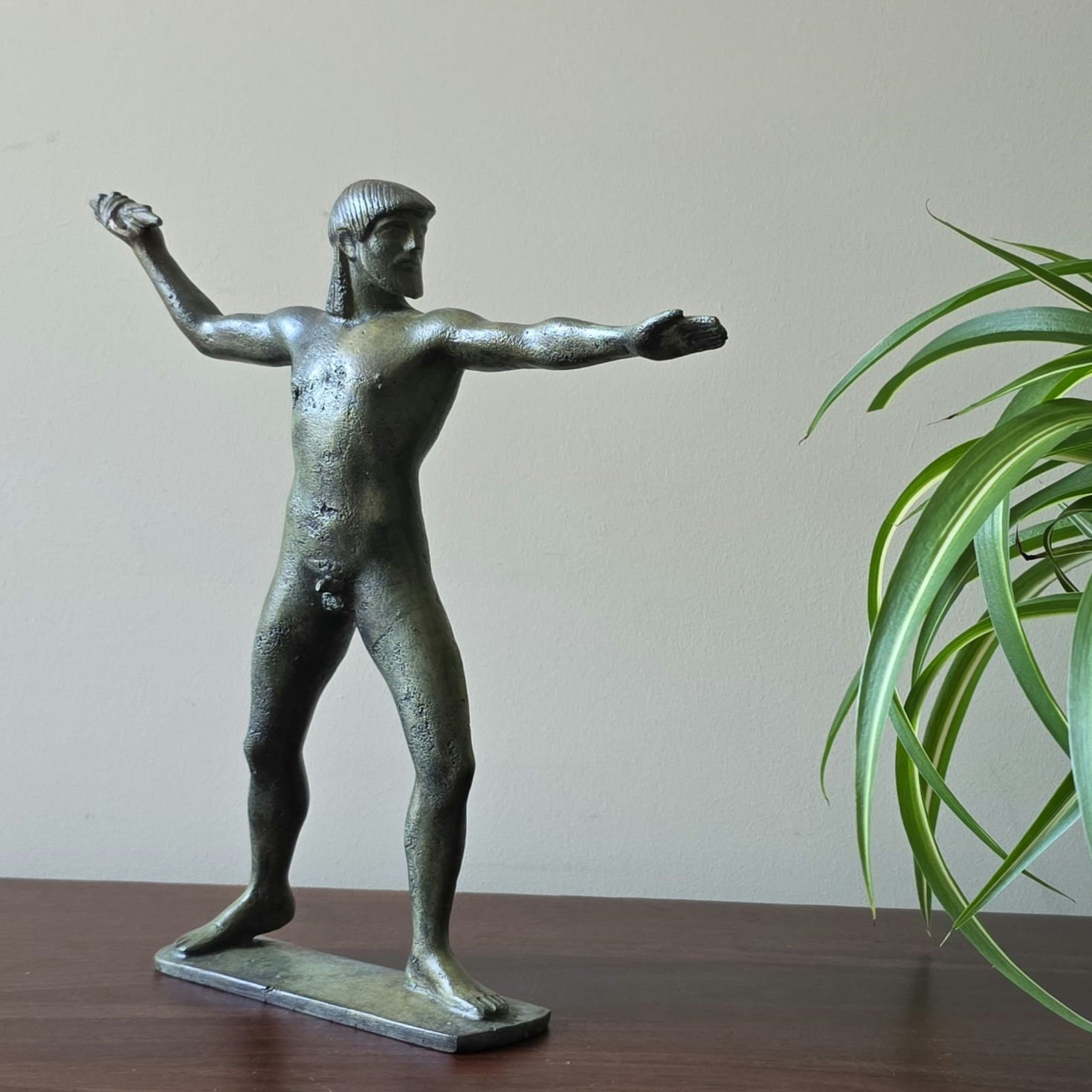 bronze statue of Zeus god of justice and hospitality