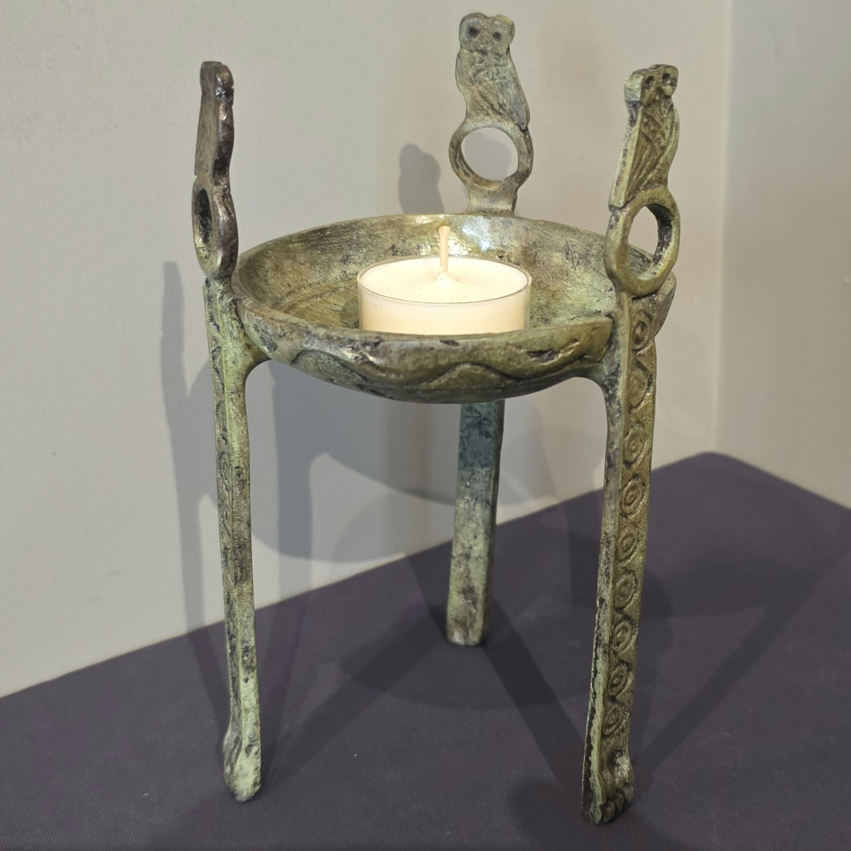 bronze tripod with owls