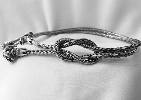 Thumbnail: woven necklace with loveknot and rams