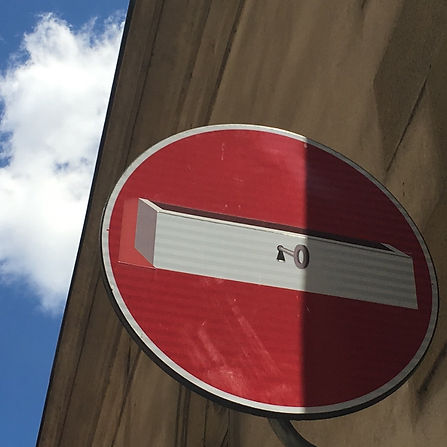 a no entry roadsign with a lock and key by Clet Abraham