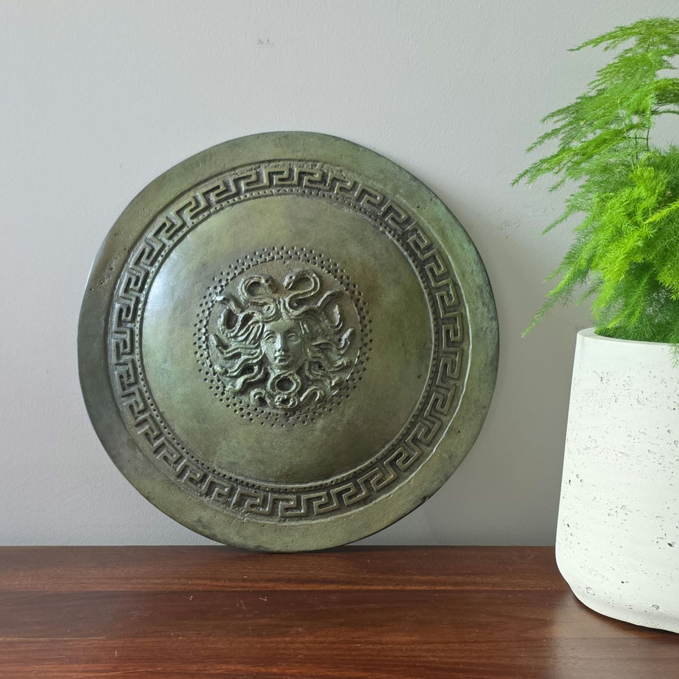 large bronze wall-mounted shield with the Gorgon Medusa
