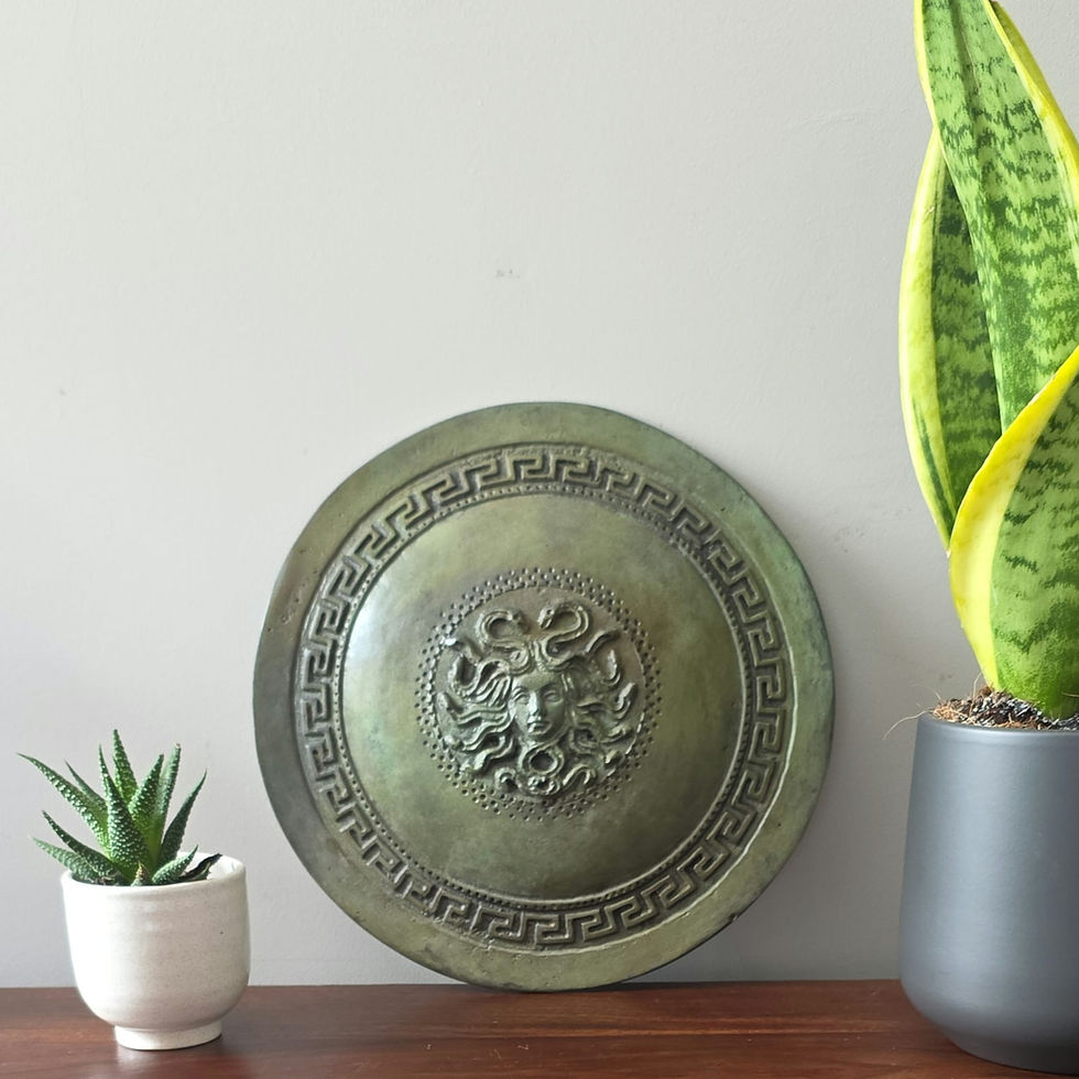Thumbnail: large bronze wall-mounted shield with the Gorgon Medusa