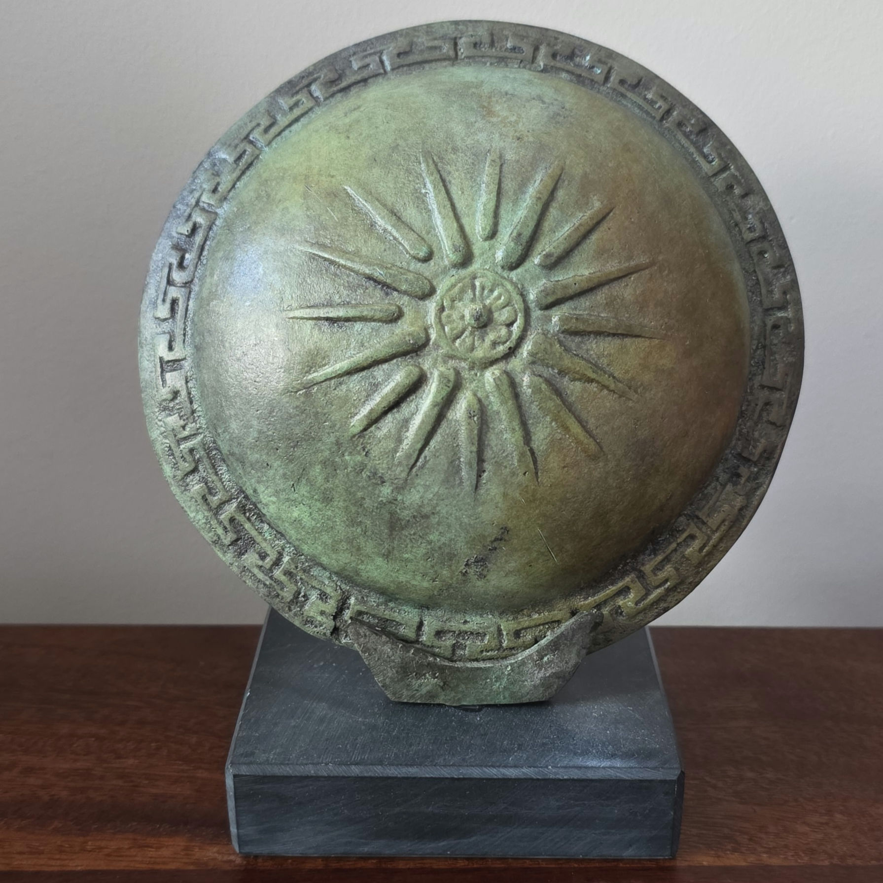 small bronze shield with the rays of Alexander the Great