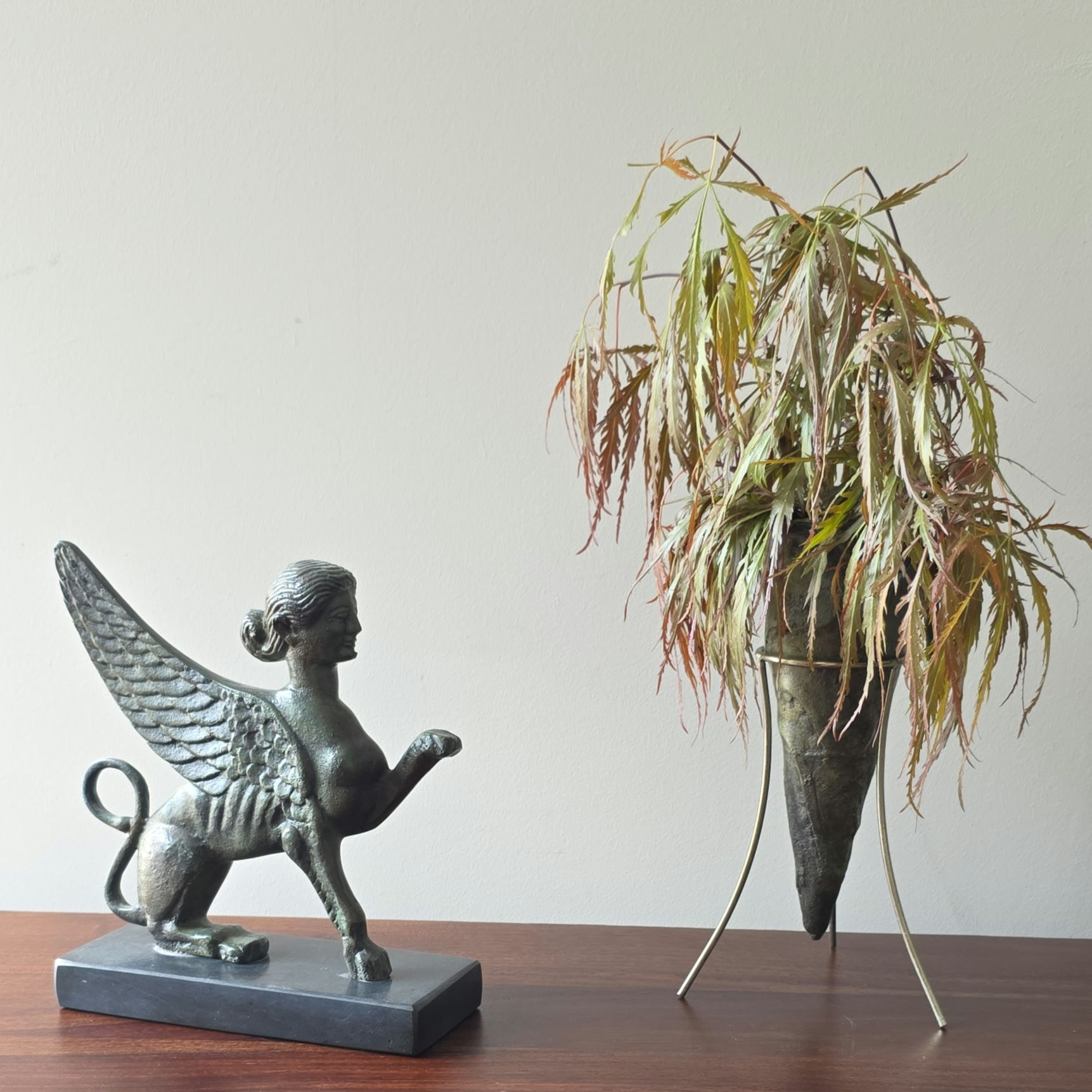 bronze sphinx on a marble base