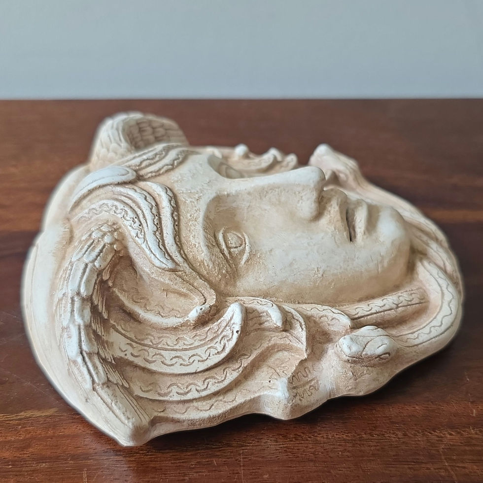 small wall-mounted dramatic mask of the Gorgon Medusa