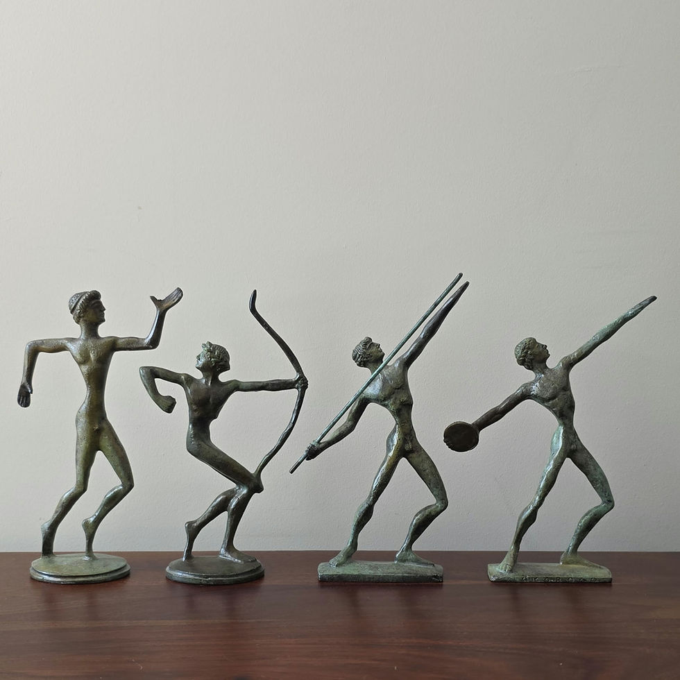 Thumbnail: stylised slim bronze figurine of a runner in motion