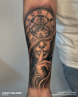 LS Lady and clock tattoo