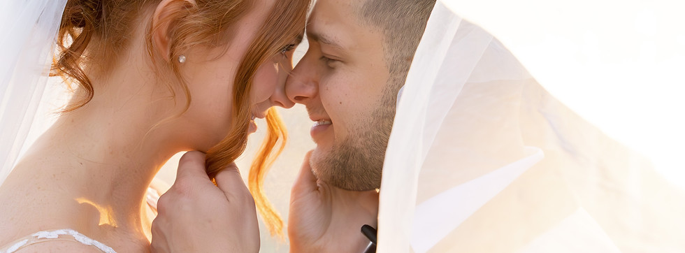 Married couple under their veil