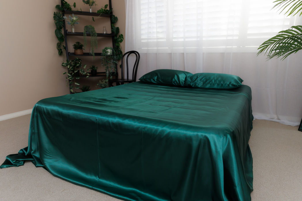 bed with green satin sheets