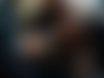 Woman posing confidently in an elegant den set at a boudoir studio