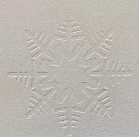 Christmas card with a traditional Polish paper cutout motif, dry embossed print.