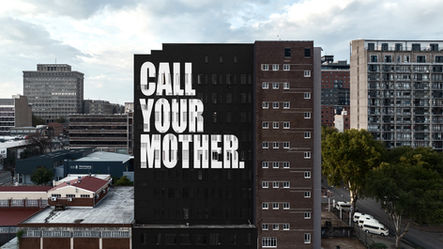 CALL YOUR MOTHER by Ed Young in Braamfontein, Johannesburg. A painted mural commissioned by Meta Foundation. PLNTH managed the mural production. 