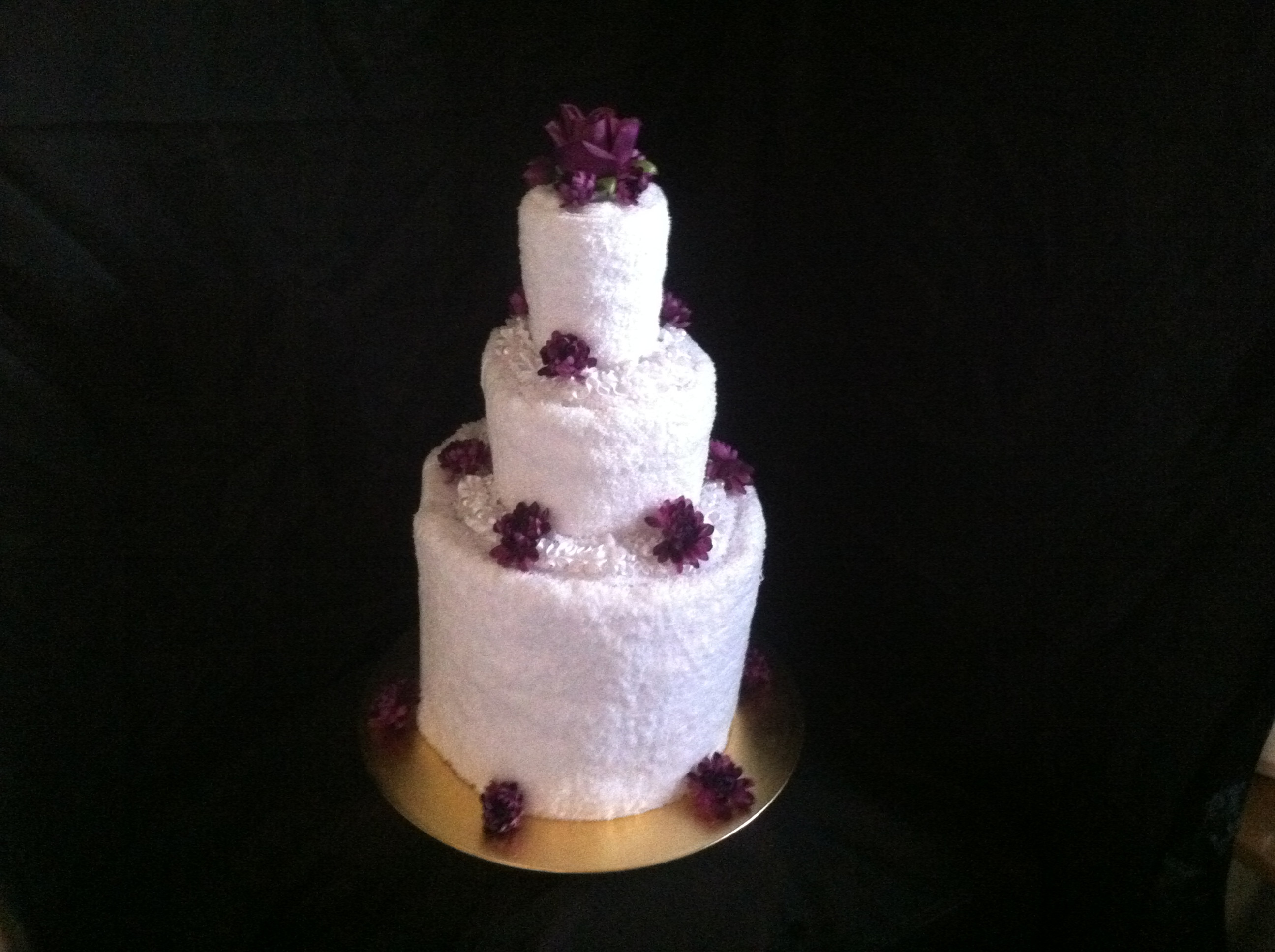 Towel Cake with Purple Flowers