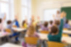 education, elementary school, learning and people concept - group of school kids with teac