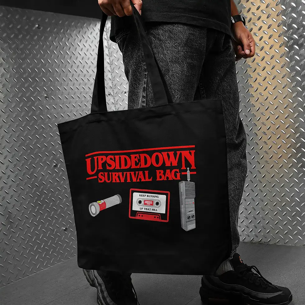 Thumbnail: man holding a Stranger Things Tote Bag - Upside Down Survival Bag