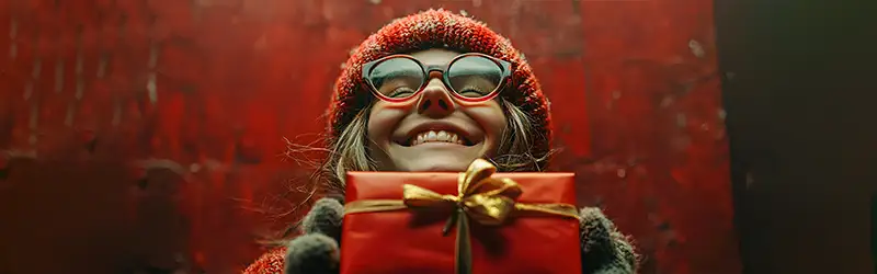 smiling geek with red gift box