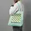 Thumbnail: man shouldering a duckegg coloured Chess Club tote bag