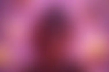 smiling woman surrounded by geek gifts