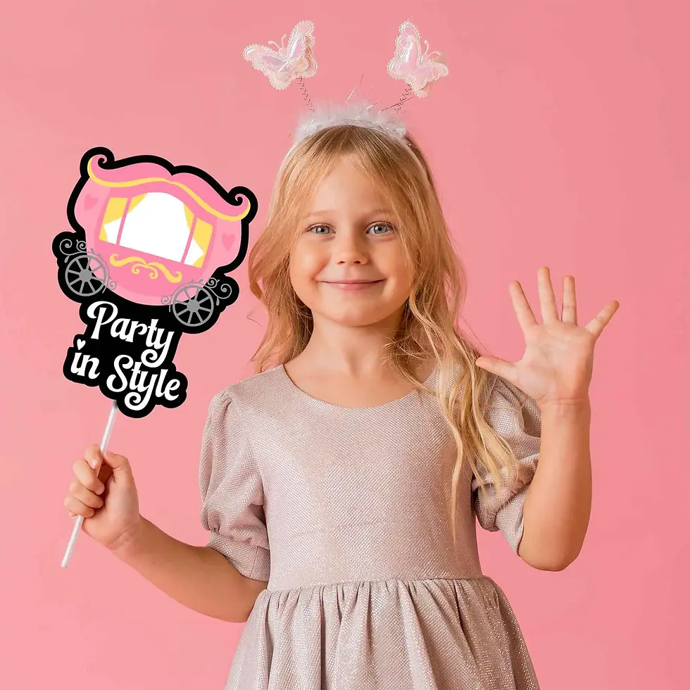 Thumbnail: young girl smiling holding a carriage photo booth party prop