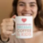 smiling woman holding powered by Dreams, Coffee & Kids - Mothers Day Gift