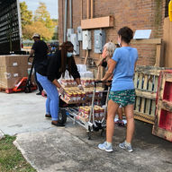 Broadmoor volunteers outside Broadmoor Arts & Wellness Center