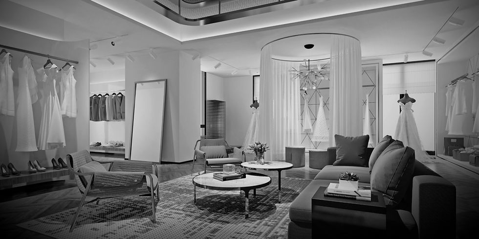 Luxurious bridal fitting room featuring wedding gowns, elegant sofas, and large mirrors.