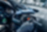 Professional interior detailing service cleaning a vehicle dashboard and air vents