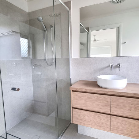 Renovated ensuite, above counter basin, inwall chrome tapware, timber vanity, custom shower glass