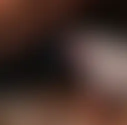 Workers cleaning and organizing a cluttered attic.