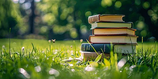 pngtree-springtime-reading-stack-of-books-outdoors-on-green-lawn-for-students-image_163066
