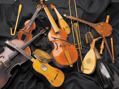Assorted selection of early music instruments on a black background