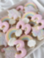 Marble unicorn cookies with number 3 and rainbows