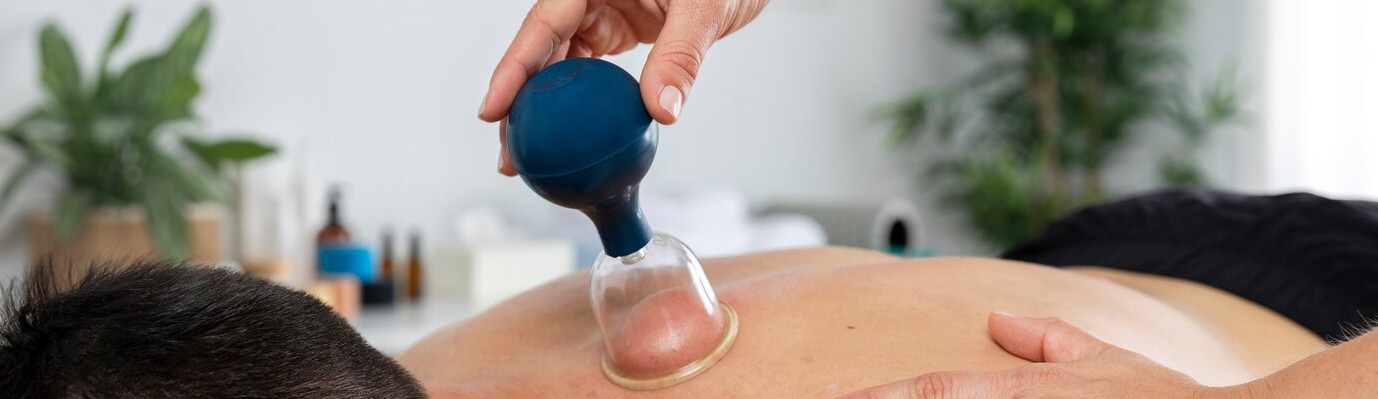 physiotherapist-performing-cupping-session-male-patient_23-2149143822.jpg