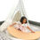Thumbnail: Girl playing with 3-in1 Baby Nest Montessori Rocker, Grey cotton, Natural beech wood