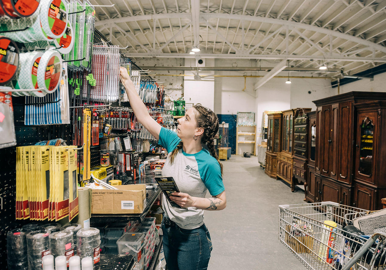 A shopper browsing the tools aisle inside the Habitat ReStore in Madison, Indiana
