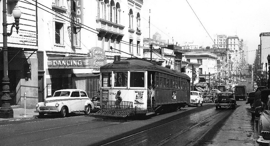 Black and white street view with trolley