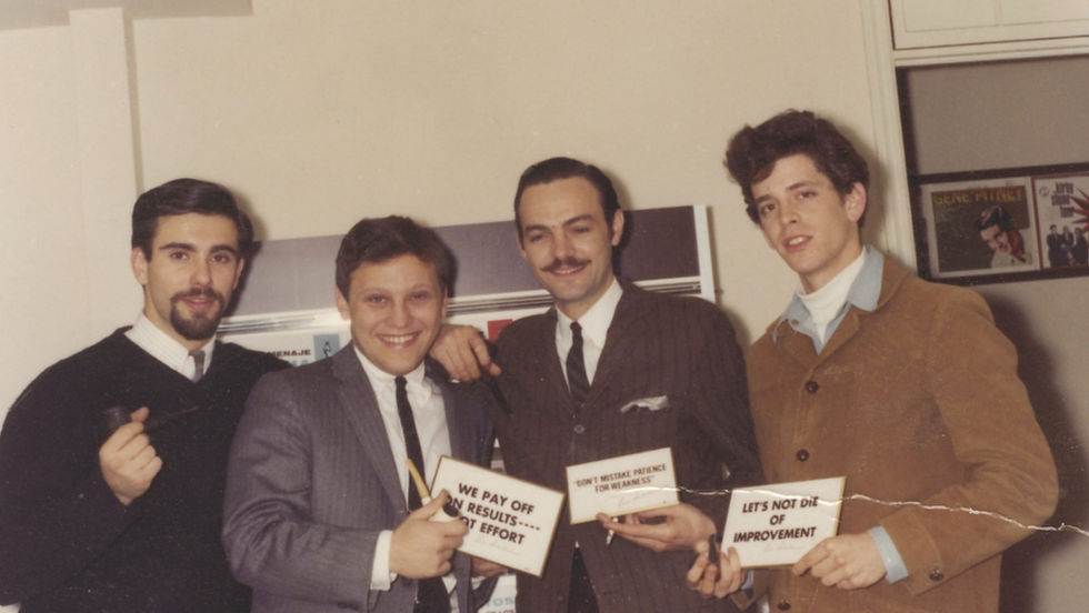 Polaroid of men in suits