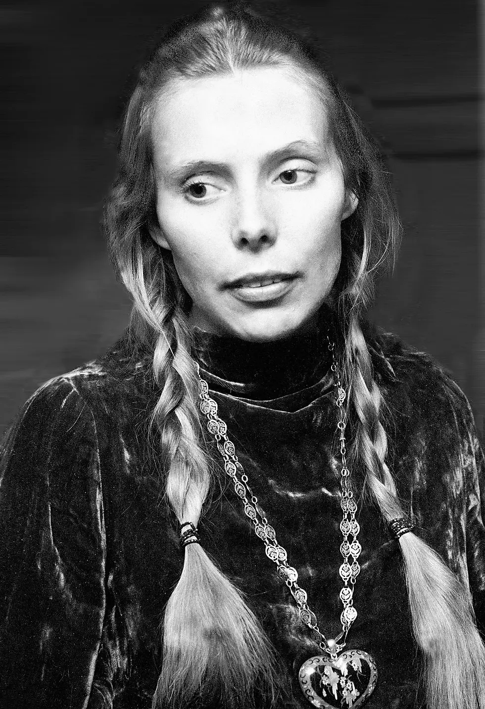 Black and white photo of blonde woman with hair in braids