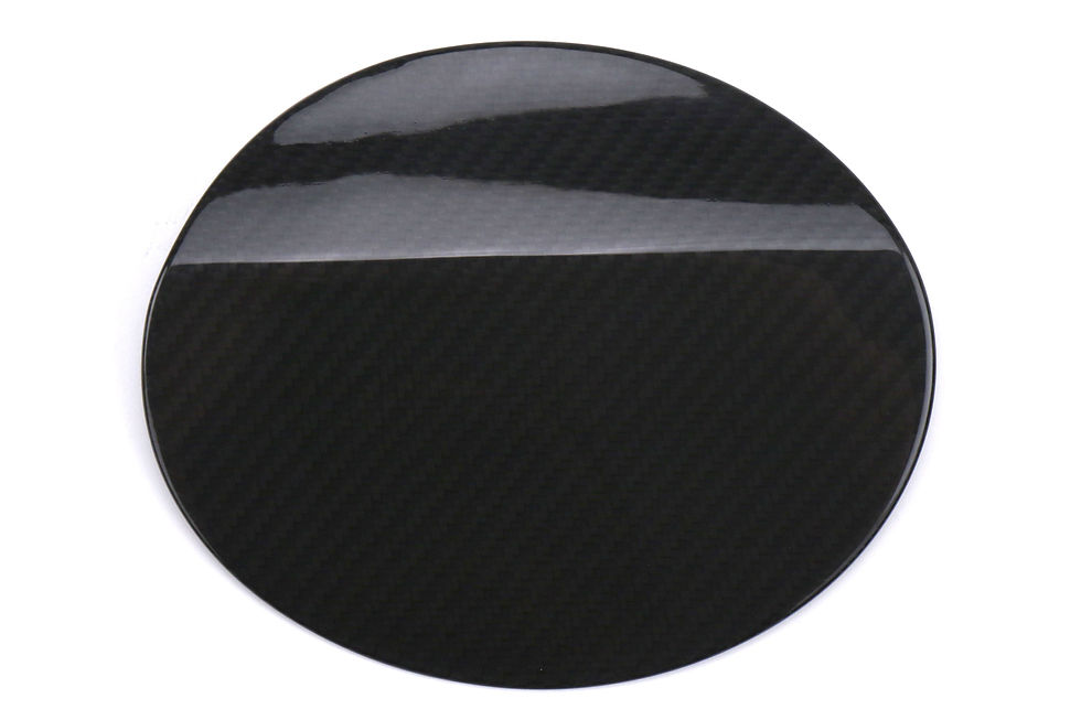 The OLM Dry CF Fuel Door Cover is designed to provide a stylish upgrade to the