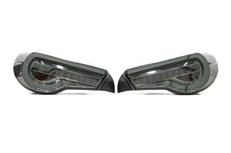 The transition from stock tail lights to OLM Smoked Facelift Style Sequential