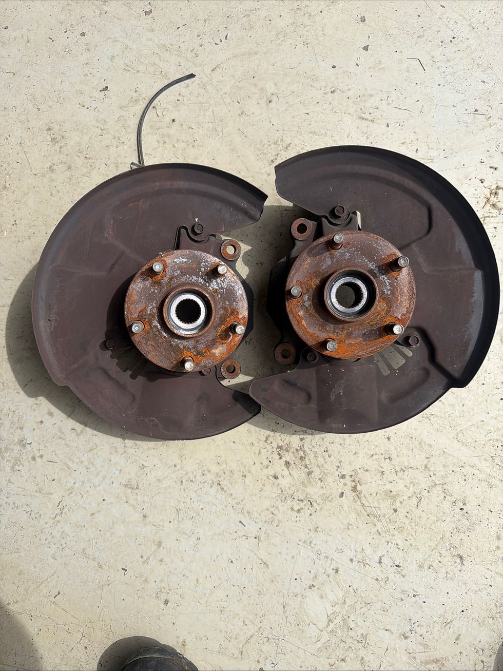 OEM 02-03 Impreza WRX wheel hubs and dust shields.