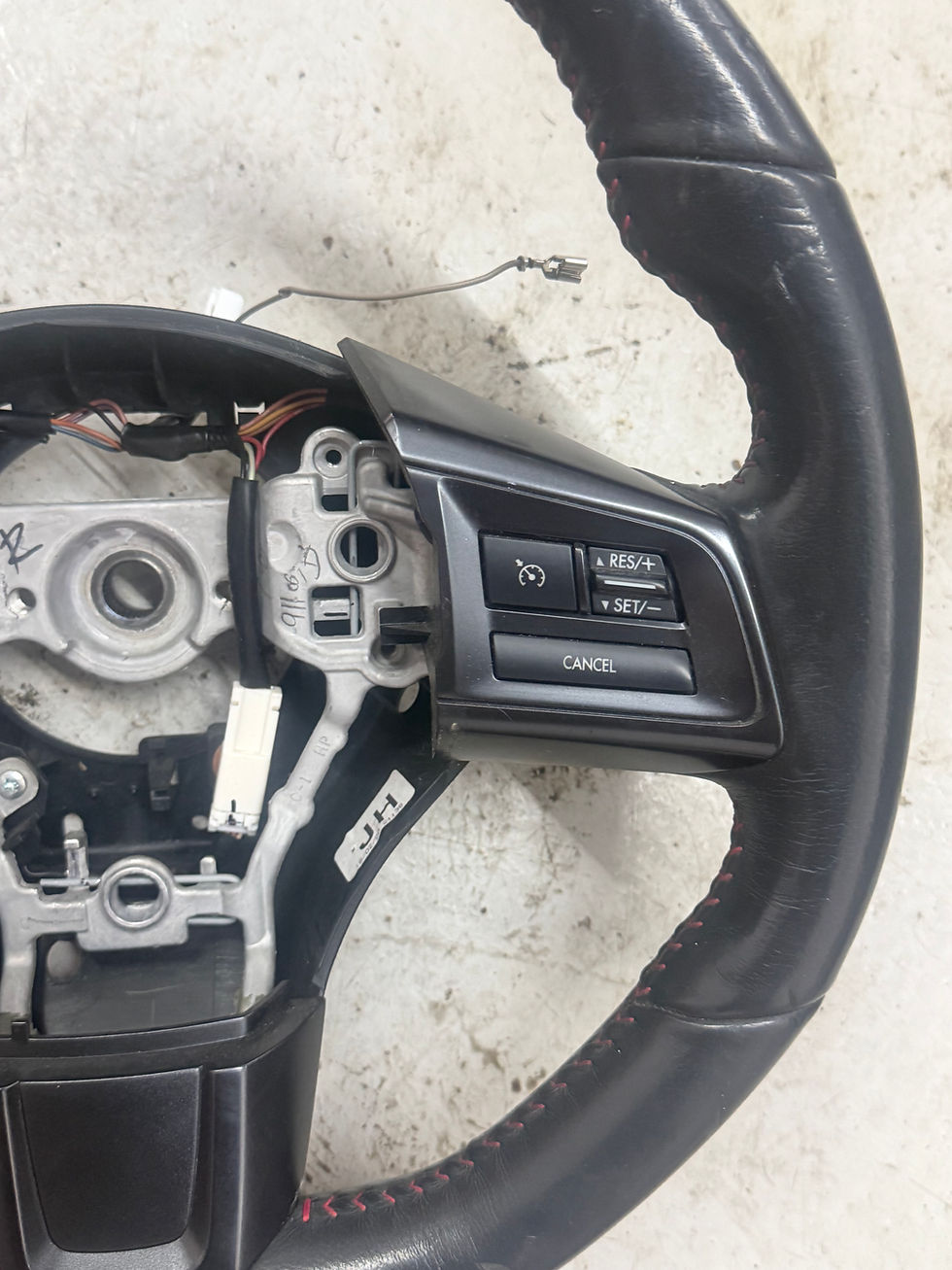 Thumbnail: Subaru WRX Impreza steering wheel with cruise control.