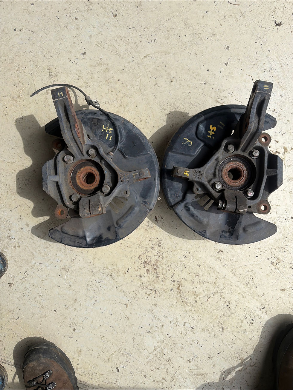 OEM 02-03 Impreza WRX steering knuckles and dust shields.