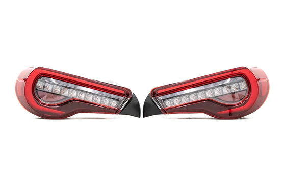 The transition from stock tail lights to OLM OE Style Clear Lens Facelift Style